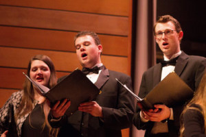 Soloists alto Michelle Cox, baritone Dan Gibbs and tenor Christopher Bingham singing J.S. Bach's Christmas Oratorio with Siskiyopu Singers in concert at SOU Music Recital Hall on Dec. 13, 2014. Photo by Pam Danielle.