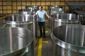 Naumes Crush and Fermentation Winemaker Chris Graves inspects the new tanks.