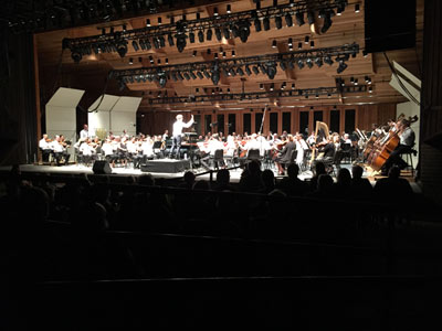 Maestro Teddy Abrams leads the Britt Orchestra in a performance of Aaron Copland’s Billy the Kid Suite at the Britt Pavilion in Jacksonville, OR on Aug. 7, 2015.