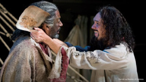 Edmond Dantes (Al Espinosa) embraces fellow prisoner Faria (Derrick Lee Weeden) upon receiving Faria’s treasure map in Act 1 of OSF’s The Count of Monte Cristo.