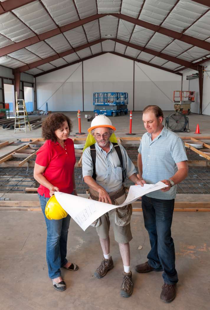 COO Laura Naumes and Winemaker Chris Graves (right) look over plans for Naumes Crush and Fermentation with Kyle White, project manager.